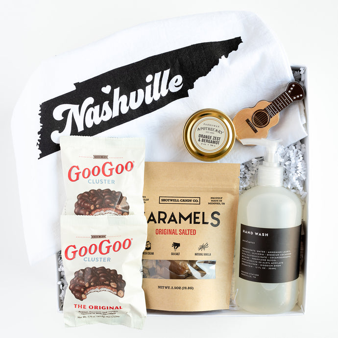 Nashville Closing Gift filled with Goo Goo Clusters, Kitchen Towel, Candle, Mints, Caramels and Hand Soap. 